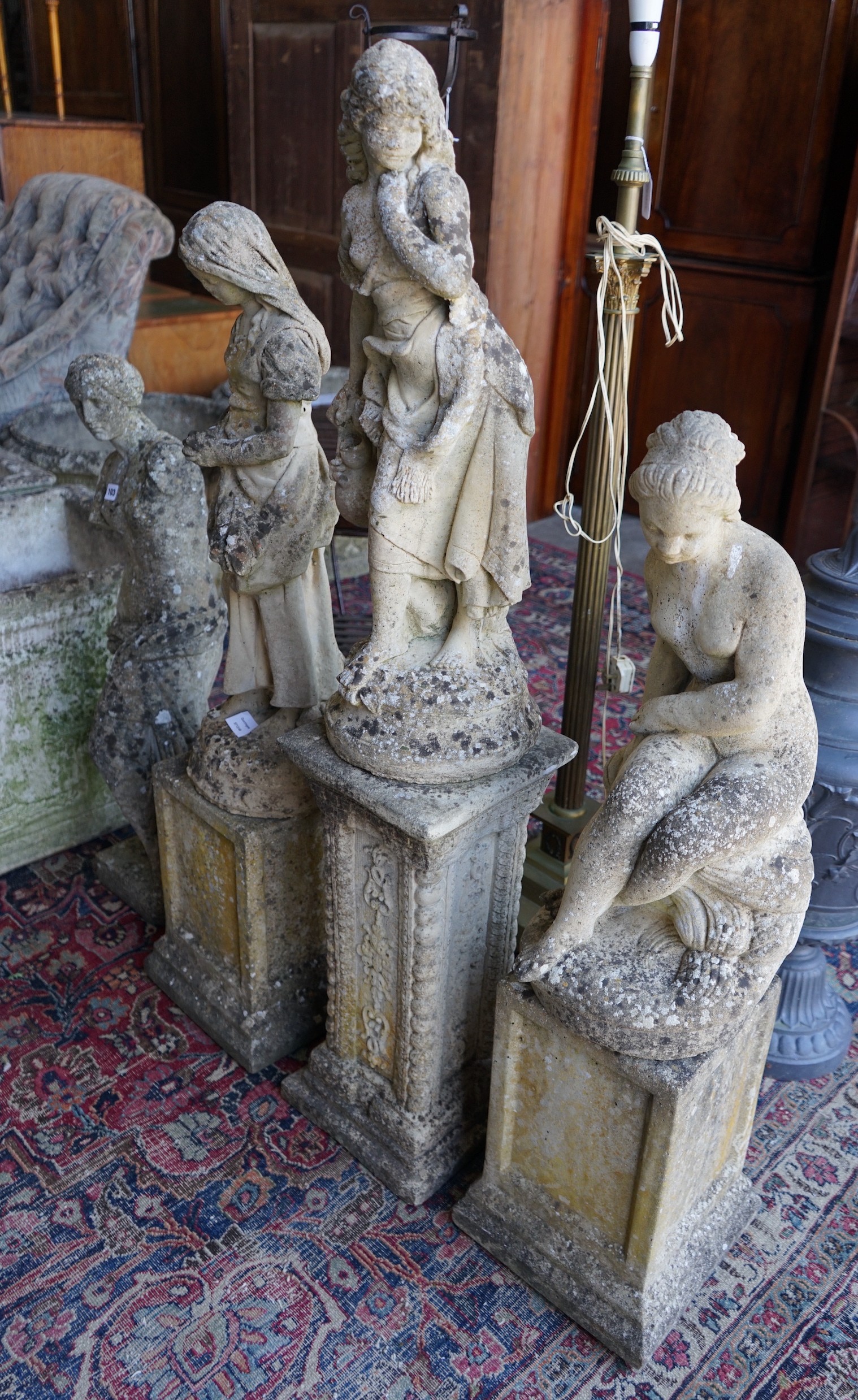 Four reconstituted stone garden statues, largest height 124cm